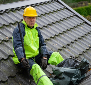 Roofing contractor installing shingles on a custom home new construction project in SC