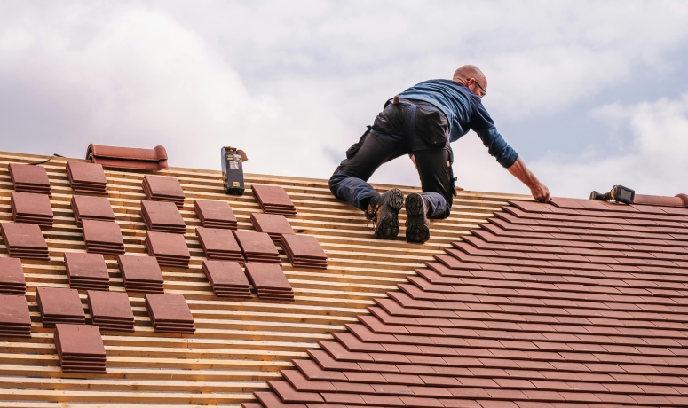 Roofers replacing shingles on a townhome following HOA roofing rules South Carolina