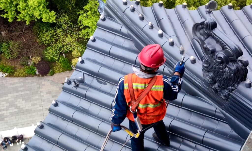 Contractor inspecting a rental property roof to support landlord roof responsibilities in SC
