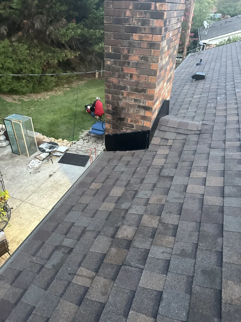 Chimney flashing roof repair on a Spartanburg home with new shingles installed