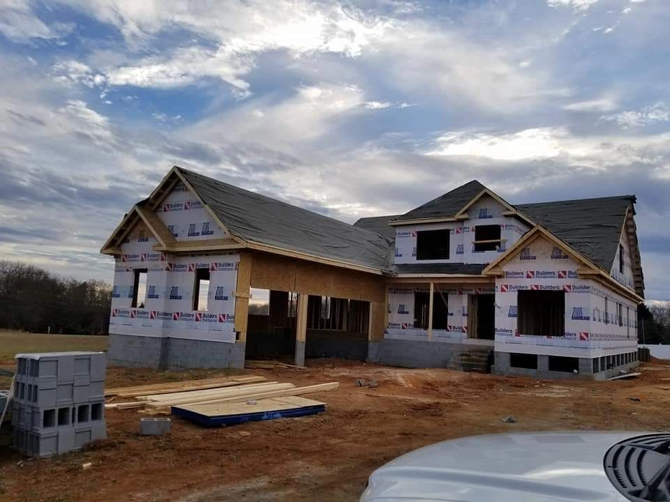 New construction roof replacement in Spartanburg SC with underlayment installed on a residential home before shingle installation.