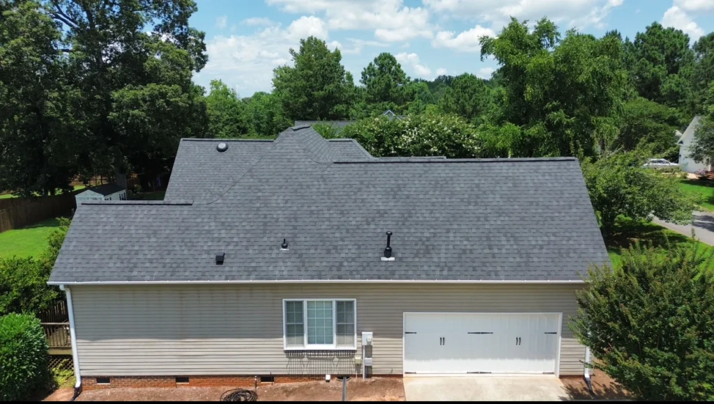 Newly restored roof after storm damage repair on a residential home.