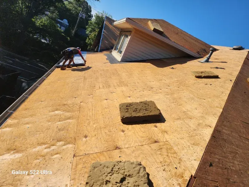 Local roofing contractors collaborating on a flat roof project in South Carolina