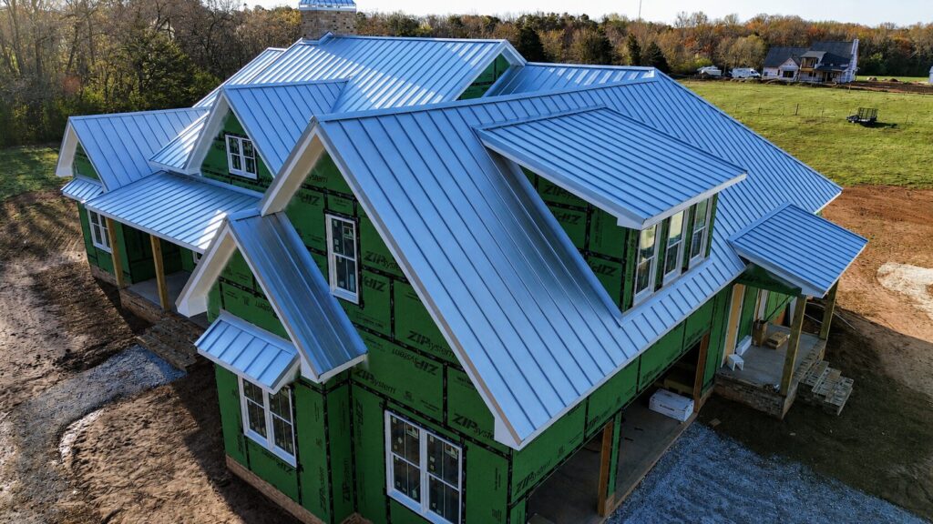 Roofing crew working on a residential roof as part of Greenville roofing services